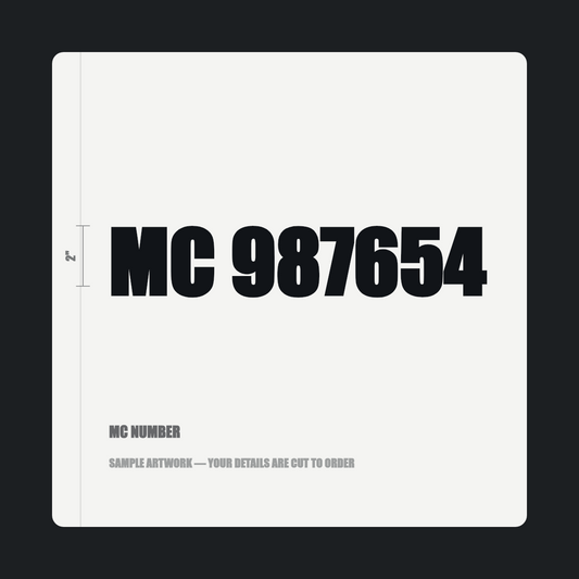 MC number — "MC 987654" cut in black vinyl on a white truck door panel